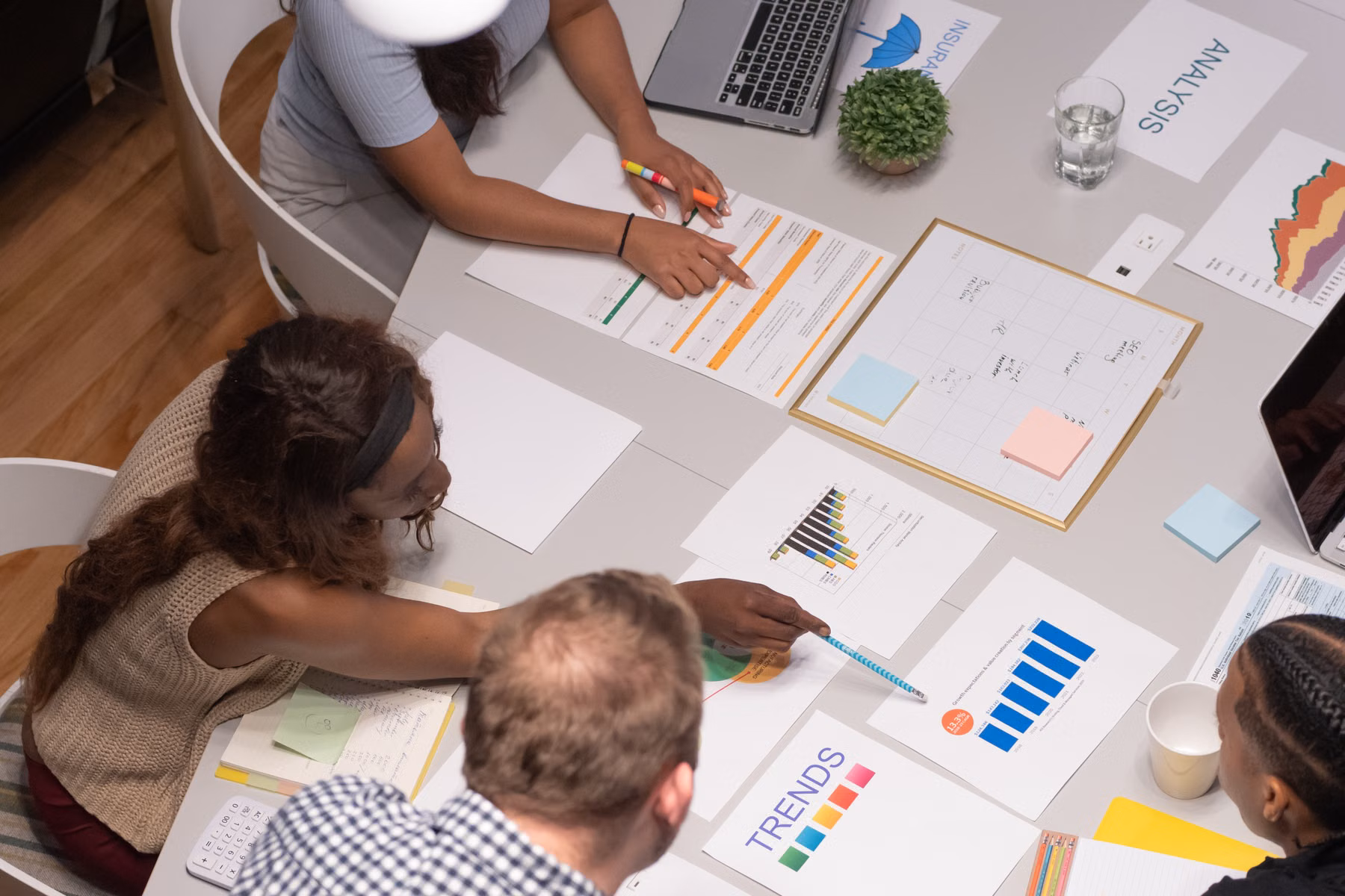 Business team reviewing charts and requirements before an ERP software evaluation