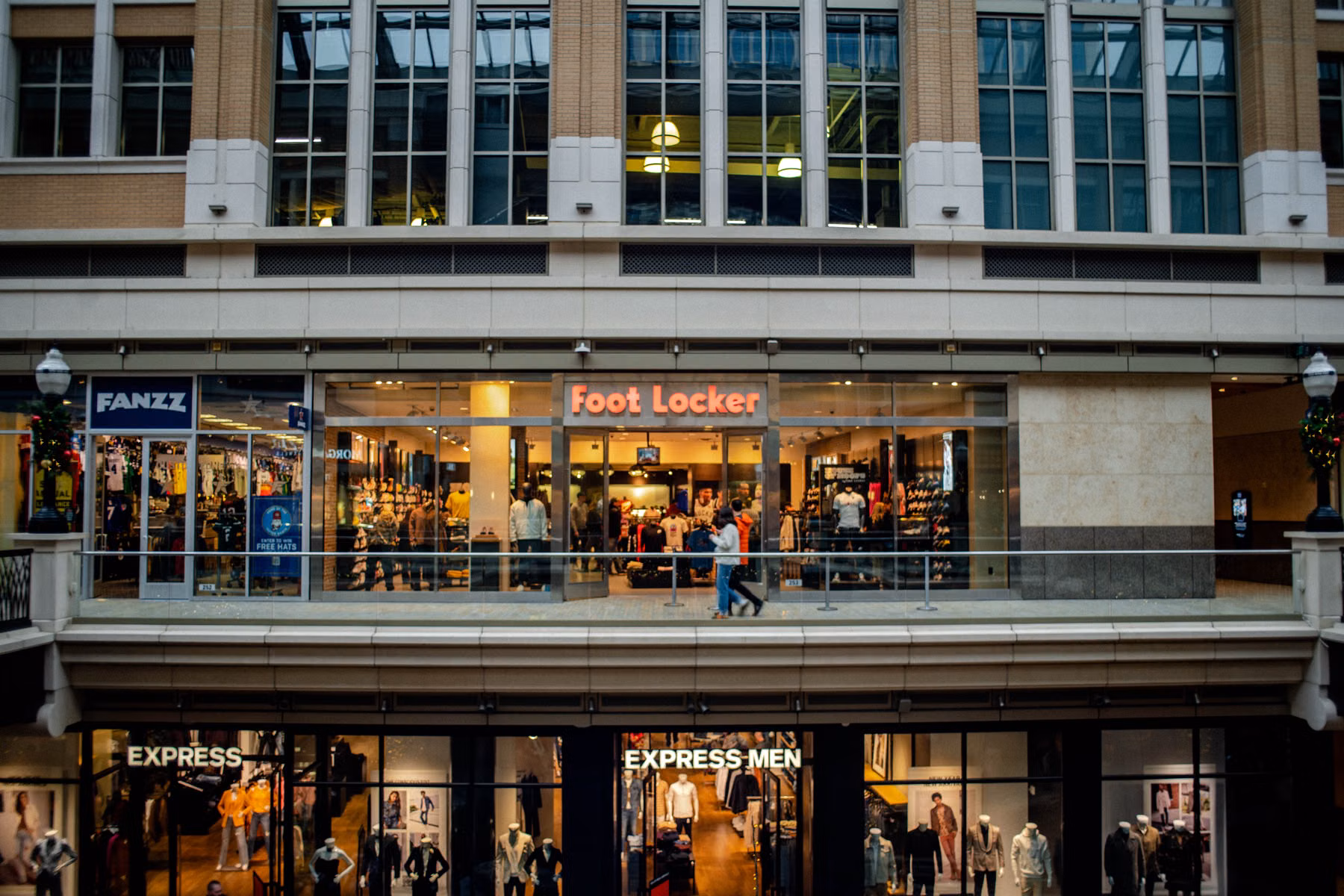 Retail stores in a shopping center representing technology standardization across multiple business locations