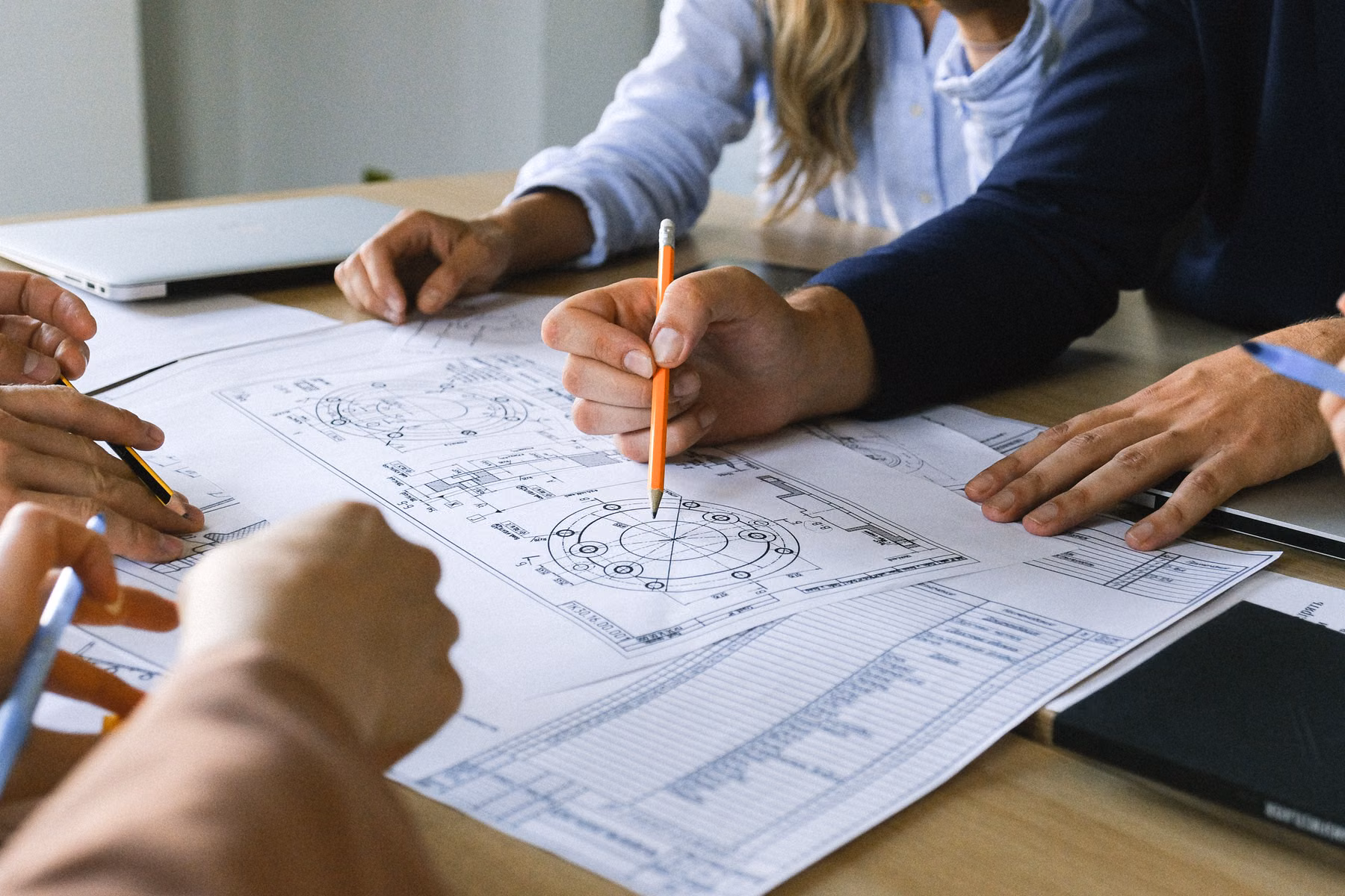 Business team comparing plans and project scope for a website or ecommerce proposal