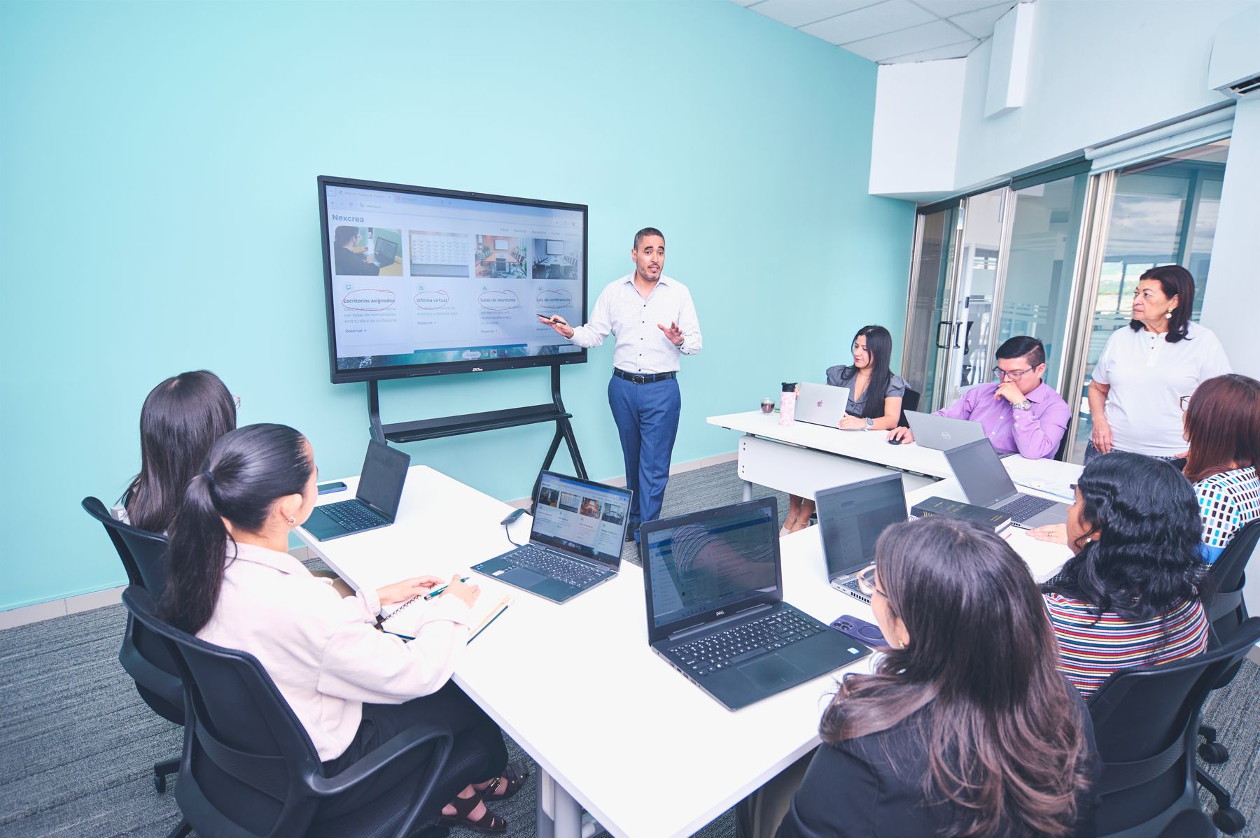 Business team reviewing a technology project together