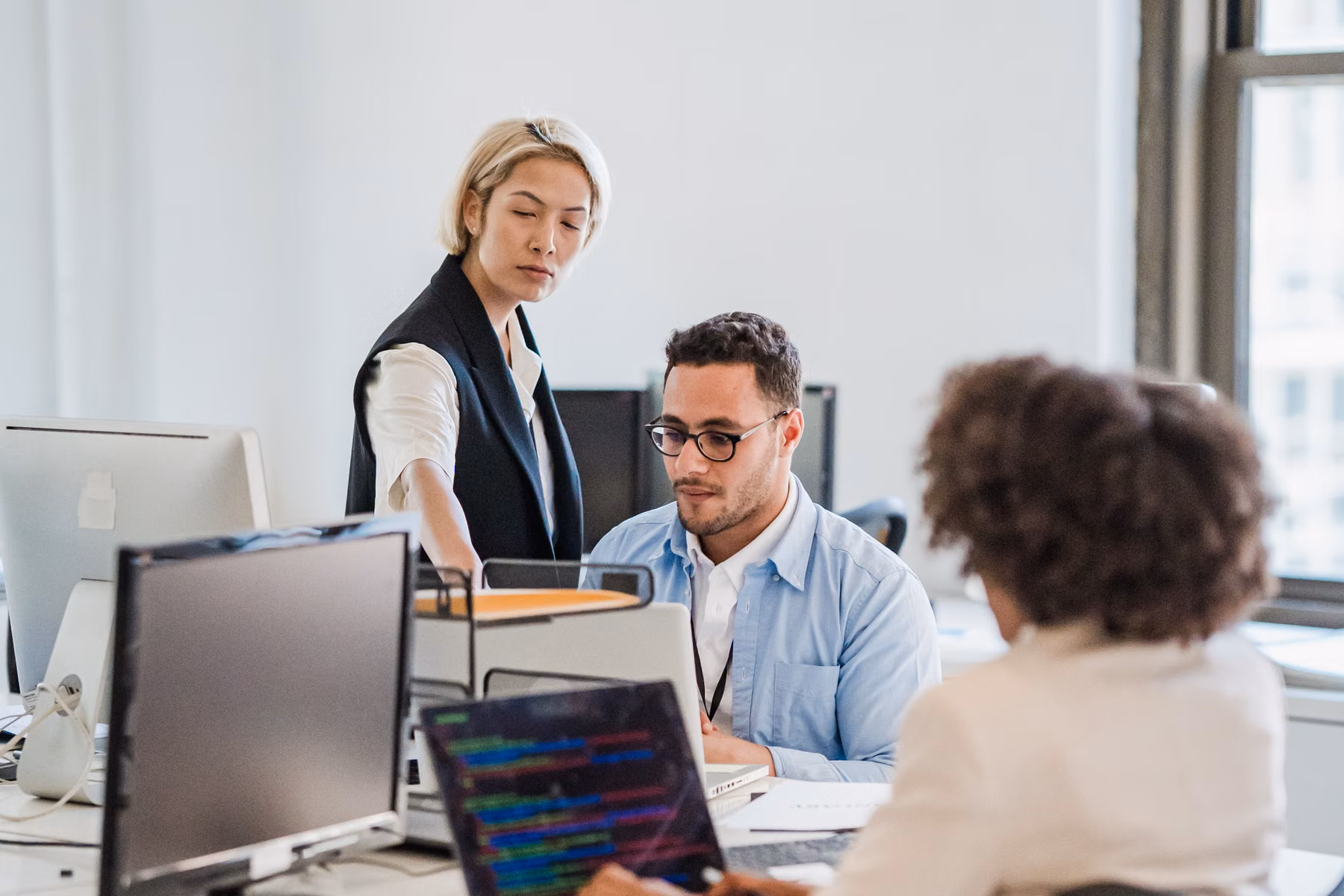 Business team working with computers in a modern office
