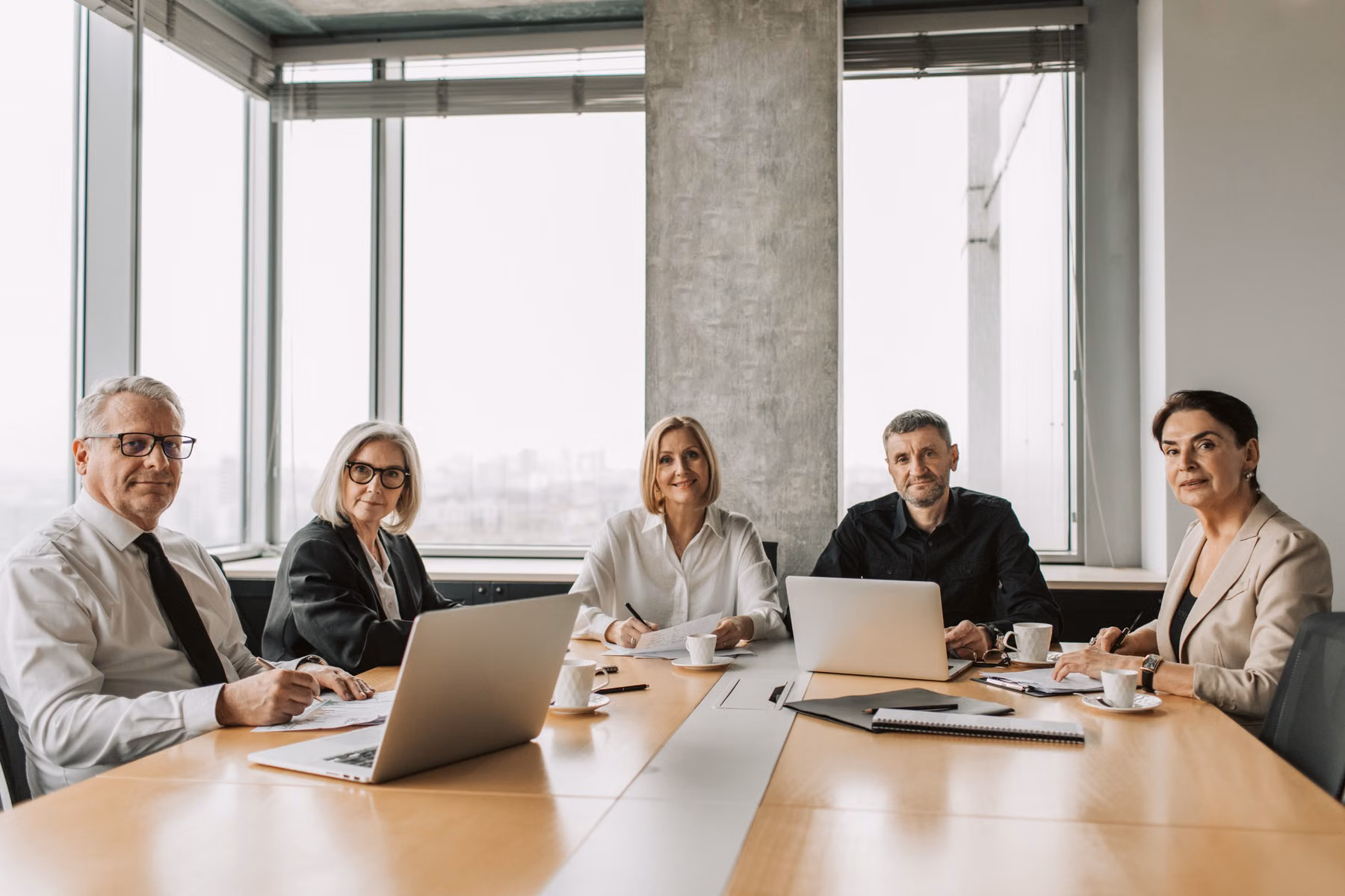 Mature association board members meeting around a conference table